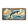 Dolphin leaping out of ocean waves illustrated on a 12x6 aluminum license plate, featuring coastal marine artwork.