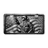 Proud soldier standing with American flag illustrated on a black and white aluminum license plate.