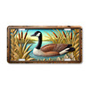 Canada goose floating in marsh water with cattails and shoreline reeds on aluminum license plate with wetland wildlife theme.