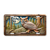 Great horned owl perched on branch under full moon in pine forest on aluminum license plate with night wildlife theme.
