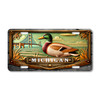 Michigan mallard duck and Mackinac Bridge license plate featuring detailed duck artwork with Great Lakes shoreline water and bridge landmark background on aluminum plate.