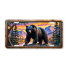 Black Bear license plate featuring rustic mountain sunset artwork with glowing skies, pine forest, and embossed-look design on aluminum.