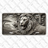 Lion license plate featuring grayscale stone relief design with regal lions, leaves, columns, and savanna backdrop in embossed-look artwork on aluminum.