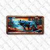 Wolf license plate featuring a bold blue wolf in a mountain river landscape with copper-orange sky on aluminum.