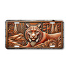 Bobcat license plate featuring rustic embossed-look artwork of a fearless bobcat resting in a woodland scene with trees, rocks, and foliage in bronze tones.