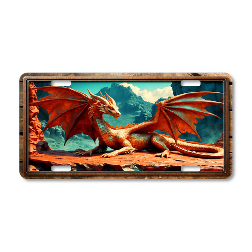 Red Dragon license plate featuring a fiery winged dragon resting on rocky cliffs with a mountain backdrop in rustic embossed-look design.