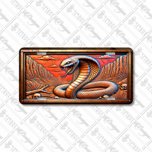 Cobra snake license plate featuring venomous coiled serpent, desert canyon backdrop, and skull accents in rustic embossed-look artwork on aluminum.