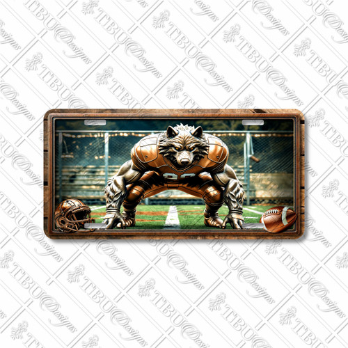 Wolf football mascot license plate featuring a crouched wolf in bronze football armor at the scrimmage line with chain-link field fence background, rustic embossed-look artwork on aluminum.