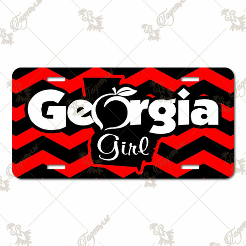 Georgia Girl license plate featuring red-and-black chevron background with white “Georgia” text, peach accent, and state silhouette with “Girl,” rustic embossed-look artwork on aluminum.