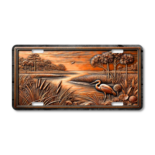 Gulf Coast marsh heron aluminum license plate featuring Southern coastal wetland grass shoreline and wildlife landscape artwork.