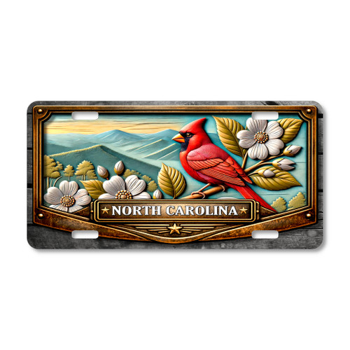 North Carolina cardinal and dogwood license plate featuring red cardinal bird with white dogwood flowers and Appalachian Mountain background on aluminum plate.