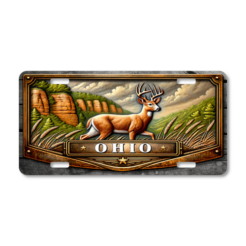 Ohio whitetail deer license plate featuring deer walking through tall field grass with sandstone cliffs and forest hills inspired by Hocking Hills landscape.