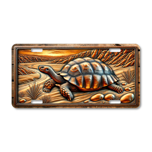 Desert tortoise license plate featuring rustic canyon artwork in bronze and copper tones with embossed-look shell detail on aluminum.