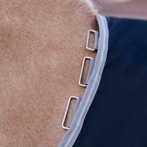 Loops for liner and neck cover on pony Amigo 1200D.