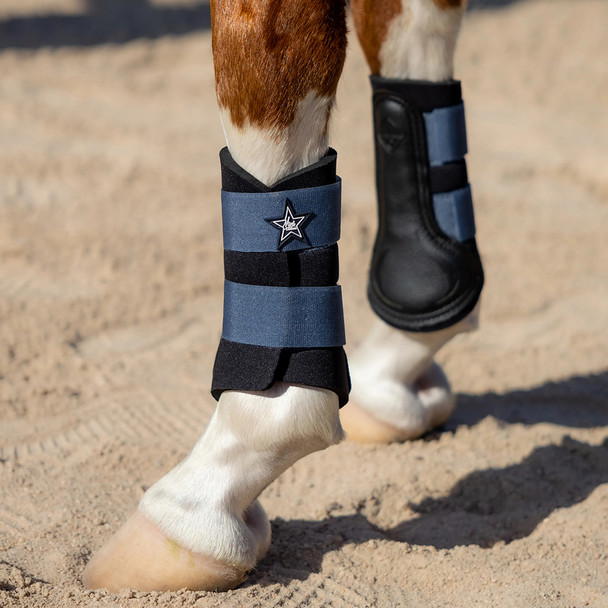 Indigo LeMieux mini grafter brushing boots.