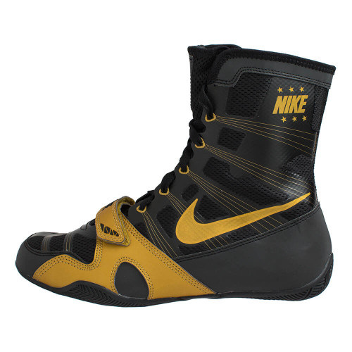 nike gold and black boots