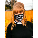 Women's version of Madcap England fabric face mask featuring retro 60s Madcap lettering black on white