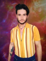 Man wearing Madcap England Capitol 1960s Mod Stripe Zip Knit Polo Top in Golden Glow