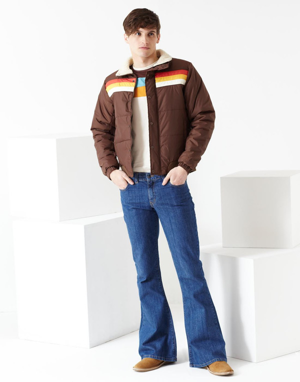 Man wearing Madcap England Rock Bell Bottom Jeans Flares in Blue Stonewash Denim
