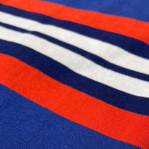 Stripe detail on Madcap England Cassette Men's Retro Chest Stripe Taped Sleeve T-shirt in Sodalite Blue