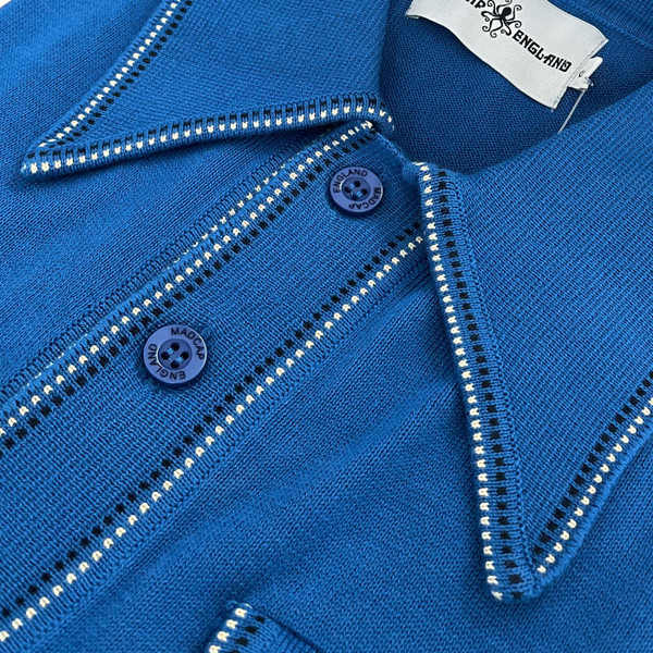 Close up detail on the Madcap England Crawdaddy Mod Big Collar Button Through Dash Tipped Polo Shirt in Deja Vu Blue