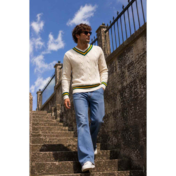 Man Wearing the Arthur Men's Retro Tipped V-neck Cable Knit Cricket Jumper in Snow White
