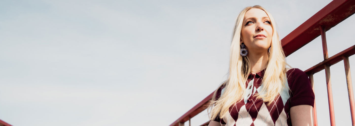 Madcap England: Mens & Womens New Season Looks - Woman wears Argyle knit dress