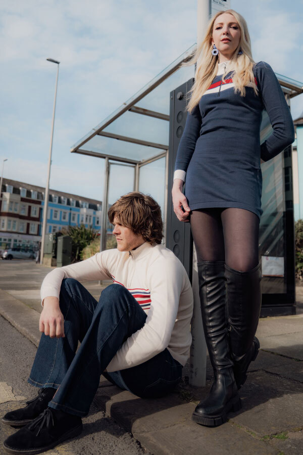 Man & woman wearing Madcap matching knitted dress and cycling top