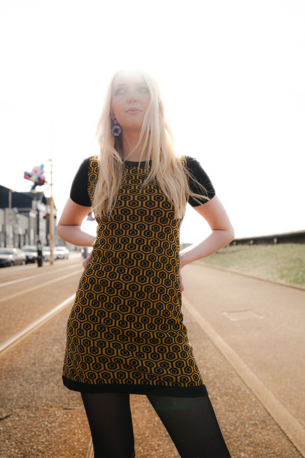 Woman wears Madcap England Knitted Retro Geo Pattern Dress