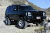 Tuff Country 87-01 Jeep Cherokee 4x4 3.5in Lift Kit with Rear Leaf Springs (SX6000 Shocks) - 43802KH Photo - Mounted