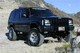 Tuff Country 87-01 Jeep Cherokee 4x4 3.5in Lift Kit with Rear Leaf Springs (SX8000 Shocks) - 43802KN Photo - Mounted