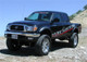 Tuff Country 95-04 Toyota Tacoma 4x4 & PreRunner 5in Lift Kit (SX6000 Shocks) - 54900KH Photo - Mounted