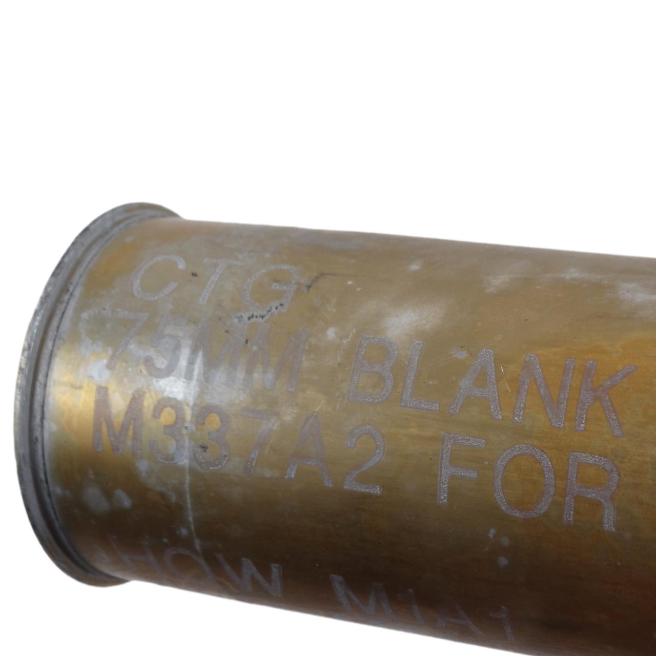 Military brass 76mm shell casing, 57mm bullet, a 48mm bullet, a 3