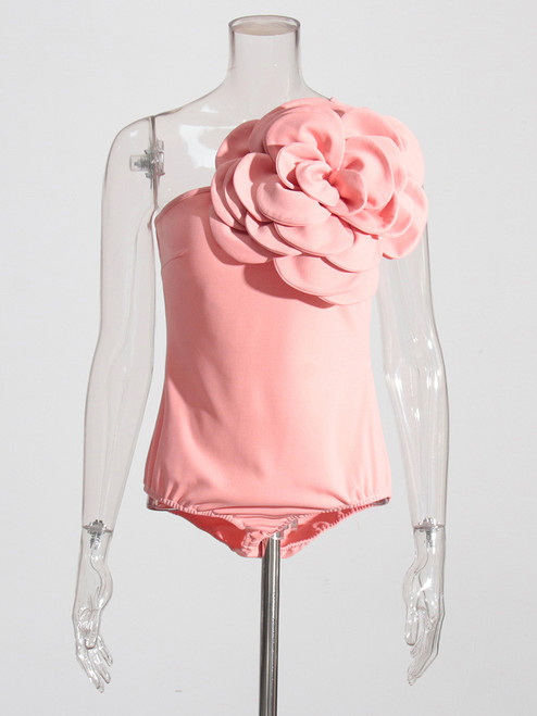 This light pink bodysuit is made of a stretchy material that fits comfortably and makes you feel like a beautiful flower with an oversized blooms