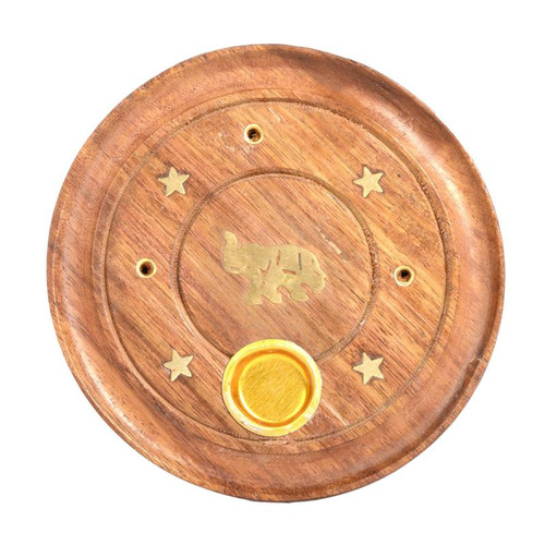 Circular wooden incense burner tray with a brass elephant design and star accents, featuring a brass incense holder in the center.