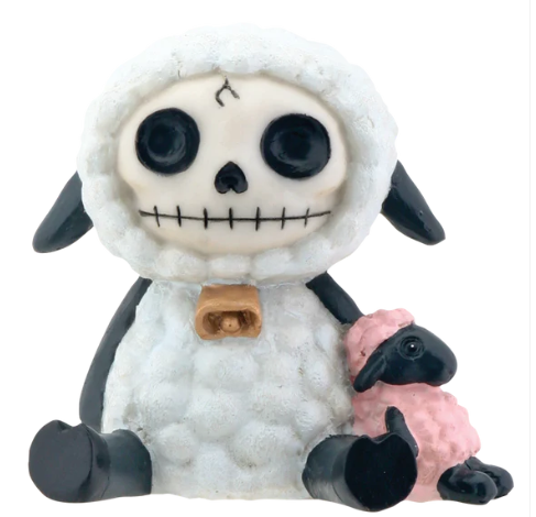Whimsical resin skeleton figurine in a sheep costume with black ears, sitting next to a tiny pink sheep for cute home decor.