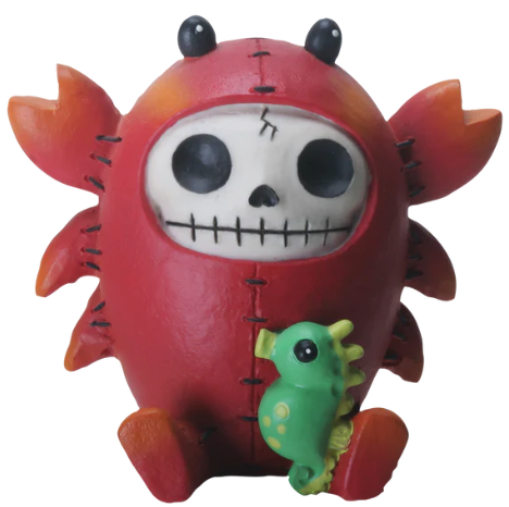 Cute red resin crab figurine with a skull face and a green seahorse beside it.