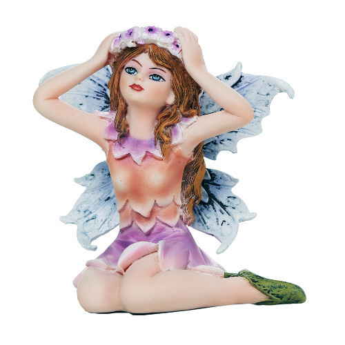 Small fairy figurine with a flower crown, wearing a pink petal-like dress and green leaf-inspired shoes, seated with wings extended.