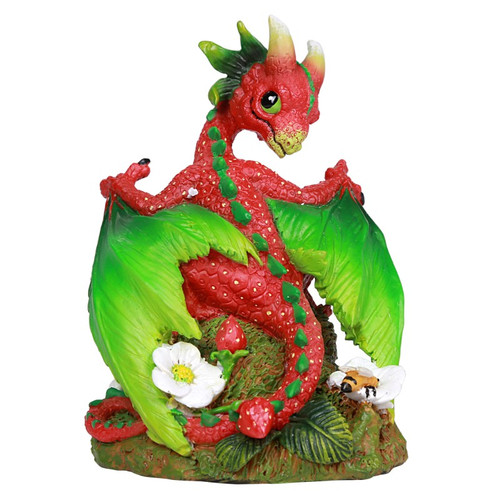 Colorful figurine of a strawberry dragon with green wings, surrounded by strawberries, white flowers, and a bee.