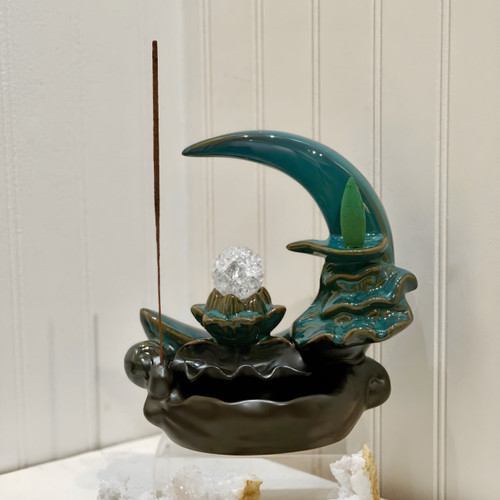 Crescent moon incense holder with space for incense sticks and backflow cones.