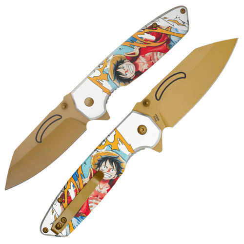 A folding pocket knife featuring a vibrant, full-color graphic of Monkey D. Luffy in his signature red vest and straw hat against a white and light blue background with golden lightning accents. The image shows two views of the knife: one with the gold-toned, wide-profile blade extended and the other showing the reverse side with a matching gold pocket clip. The knife features a flipper tab for easy opening and a textured grip for secure handling.