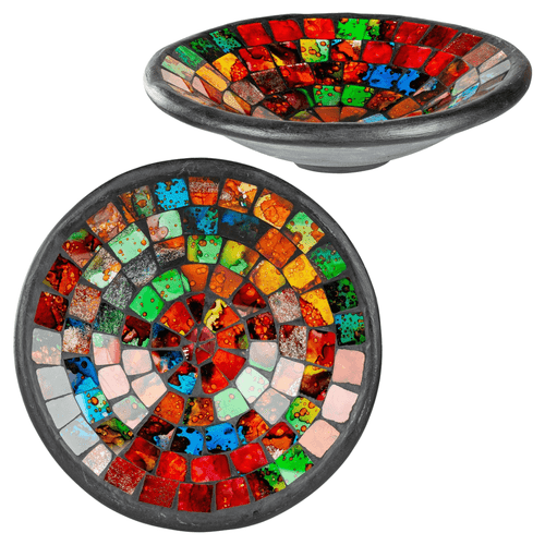 Two views of a shallow, round decorative bowl with a dark grey exterior and a vibrant, multi-colored glass mosaic interior. The mosaic tiles are arranged in concentric circles featuring bright shades of red, orange, green, and blue, creating a stained-glass or rainbow effect. One view shows the bowl from a top-down perspective, while the other shows it from a slightly tilted side angle to reveal its depth.
