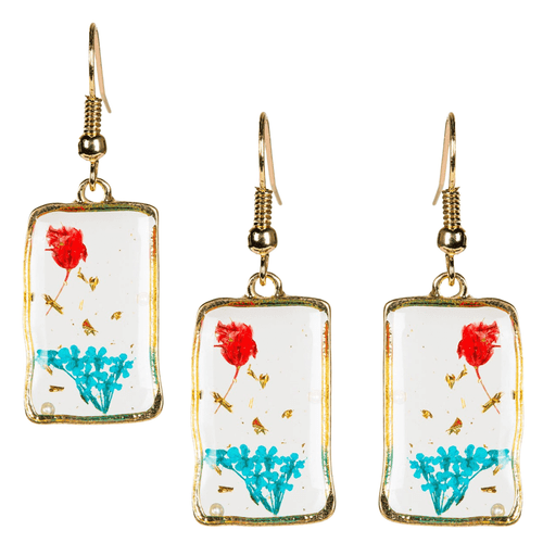 A collage of three rectangular dangle earrings featuring real dried flowers preserved in clear resin. Each earring displays a single vibrant red rosebud at the top and a cluster of small turquoise-blue blossoms at the bottom, accented with delicate gold leaf flakes.
