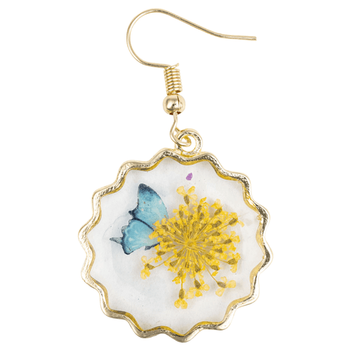 A round dangle earring featuring a real, pressed yellow wildflower and a small blue butterfly illustration preserved in clear resin. The botanical scene is encased in a gold-finished metal frame with a scalloped, flower-like edge. The earring hangs from a matching gold-tone fish-hook wire.