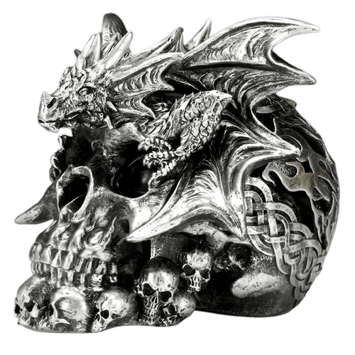 A large, metallic silver human skull figurine with a polished, weathered finish. A highly detailed medieval-style dragon is perched on the cranium, with its wings spread wide across the sides. The dragon features sharp scales and horns, while the back and sides of the skull are adorned with intricate Celtic knotwork patterns. Smaller silver skulls are clustered at the base of the jaw.