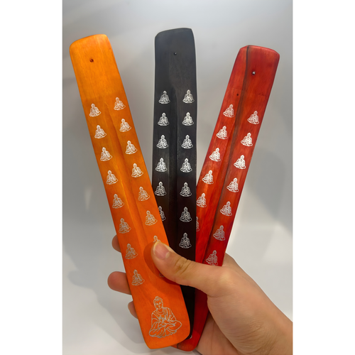 Colorful wooden Buddha incense holders in orange, black, and red for ash-catching and stylish home decor