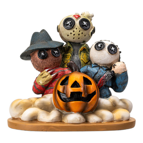 Halloween doll trio statue with eerie faces and carved pumpkin, bold spooky home decor piece