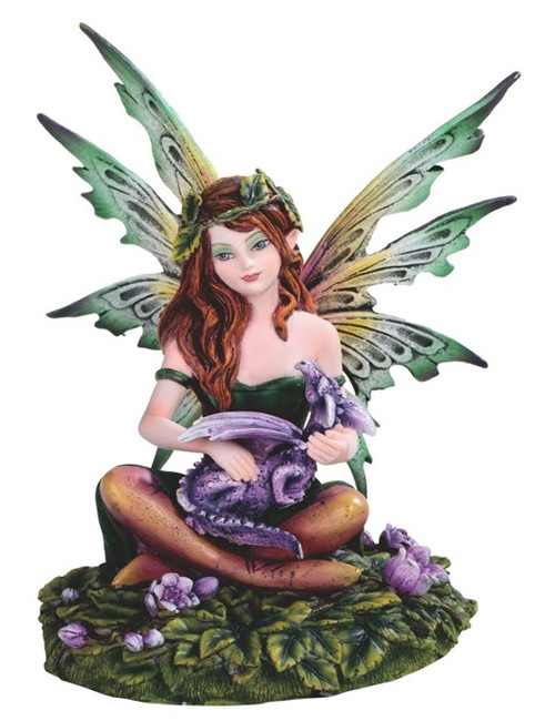 Beautiful woodland fairy statue with green wings and dragon companion, magical collectible