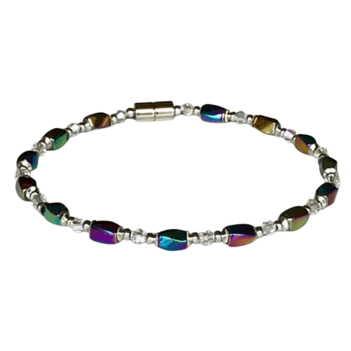 single-strand magnetic therapy anklet. It features alternating cylindrical, iridized rainbow hematite beads and smaller, round, clear crystal spacers, secured with a magnetic stainless steel clasp.