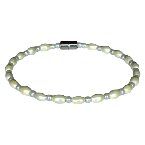 A timeless single-strand pearl bracelet featuring lustrous oval-shaped freshwater pearls and small, silver bead accents, completed with a secure, polished silver magnetic clasp.